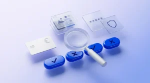 Loupe survolant des boutons d’interface, carte bancaire et écrans de portefeuille en verre dépoli.